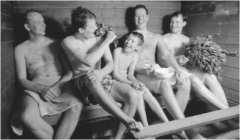 A Finnish family in a sauna in Oulu, Finland. Saunas provide a less formal, more open space for reserved Finns to express themselves.