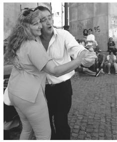 A couple dance to the music of street performers in La Boca, a working-class neighborhood in Buenas Aires which was the first stop for many immigrants coming to the New World.