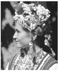 A woman wears traditional dress in Talboukhin, Bulgaria.
