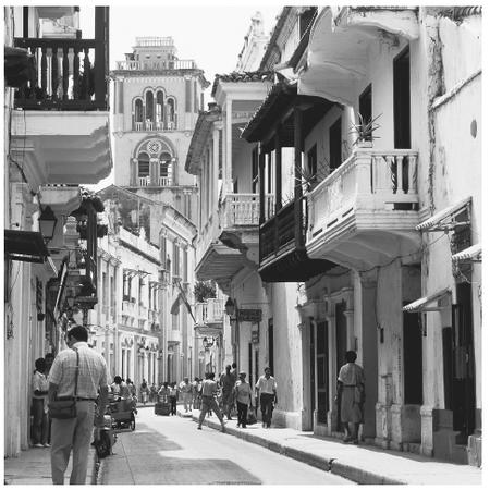 A street scene in the Colombian town of Cartagena. Houses in Colombia's cities often have two or more stories and reflect a European style.