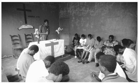 A congregation prays at an Assembly of God in Bukavu. Due to the efforts of missionaries, the majority of Congolese practice Christianity.