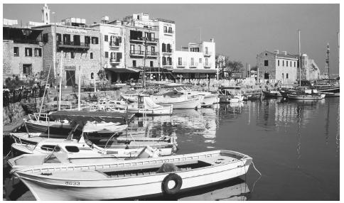 Boats moored in the harbor at Kyrenia. In seaside towns and villages, tourism and fishing are important parts of the economy.