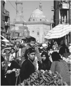 People fill the street in a Cairo market.