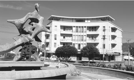 A modern sculpture in front of a building in San Salvador. The Salvadoran capital features a mix of modern amenities and extreme poverty.