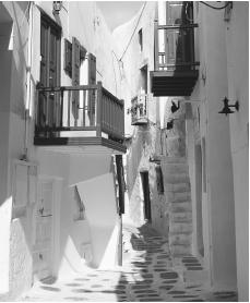 A narrow street in the Old Town section of Mykonos, Greece.
