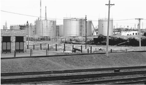 Oil refineries next to train tracks near Kul'Sary, Kazakhstan. Oil is one of the major industries in Kazakhstan.