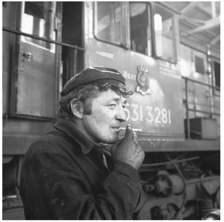 A Lithuanian railroad worker takes a break. Commercial activity in Lithuania is largely determined by geographical region.