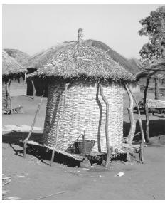 A thatched grain store in a Malawian village. Because Malawi produces no manufactured goods for export, it has an agricultural economy.