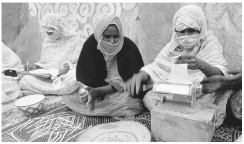 Women making pasta at a women's cooperative in Walata. Most Mauritanians work as farmers, cattle herders, or traders.