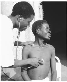 A doctor examining a TB patient in Morrumbala Hospital. The civil war took a heavy toll on medical care throughout the country.