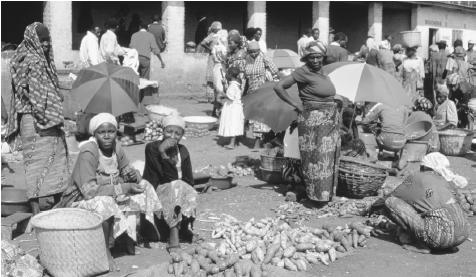 Produce for sale at the Cyangnu Market. Potatoes, beans, bananas, and sorghum are the most common Rwandan foods.