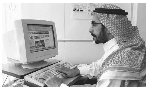 A Saudi man using the Internet in his office in Riyadh. There are substantial variations in the amount of income and accumulated wealth among Saudi Arabians.