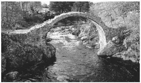 A stone footbridge in the highlands of Scotland. The highlands have rugged terrain that is difficult to cultivate.