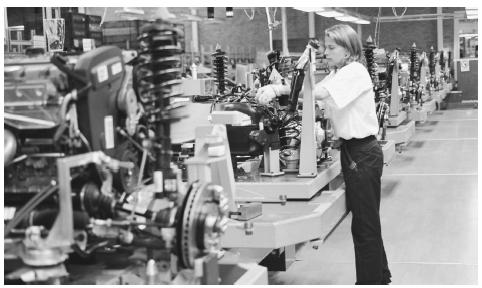 A worker assembles parts in an automobile plant in Göteborg. Automobile manufacturing is just one part of Sweden's highly diverse industrial base.