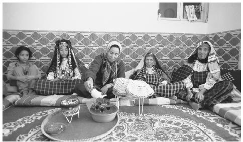 A bedouin family drink tea in Matmata. Tunisian families are patriarchal.