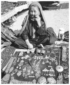 A woman sells jewelry at the Ashkhabad Sunday bazaar market.  Silver jewelry is common.