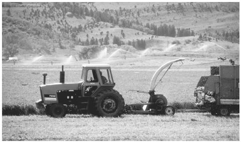 A tractor harvesting crops in the western United States. The U.S. is the world's leading food exporter.