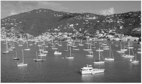 Boats in the Charlotte Amalie Harbor, Saint Thomas. Two million  tourists visit the islands annually; two-thirds of them are cruiseship  passengers.