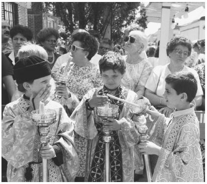 greek dating service. Altar boys light candles in preparation for a church service at St. Irene, 