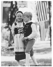 These Swedish American children are dressed in traditional costume for a fair.