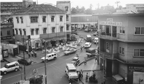 A busy street in Kumasi. Ghana's urban centers are dominated by European-style buildings, a reminder of its British colonizers.