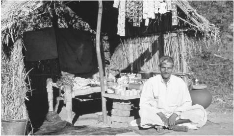 An Indian shopkeeper with his wares. Small shops still make up a big part of the Indian economy.