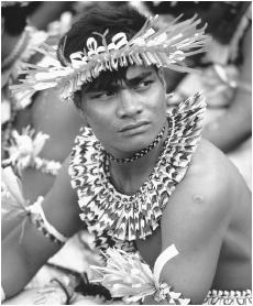 A man wearing traditional dress for a ceremony in Kiribati.