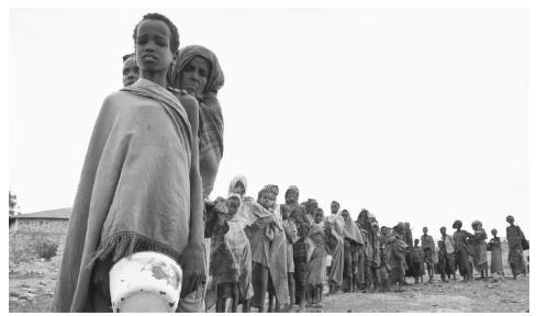Somalian famine victims wait in line for food in Baidoa. Although said to be wary of foreigners, Somalis have welcomed the international relief workers present since the 1990s.