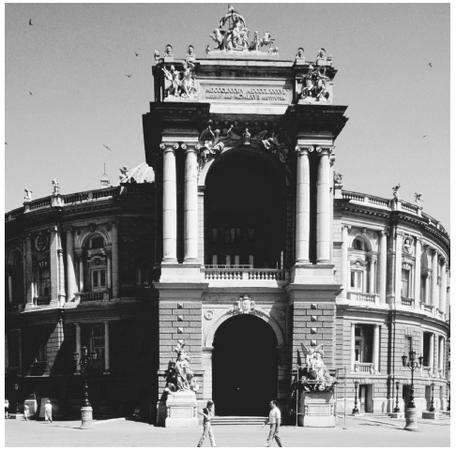 The Opera and Ballet Theatre in Odessa uses the half-columns and arches common to the Romanesque style of architecture.