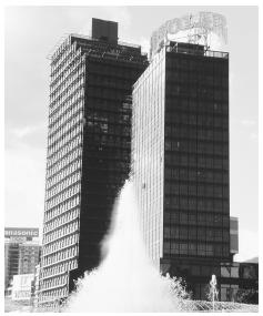 Skyscrapers and a fountain in Plaza Venezuela, Caracas, exemplify the ideals of modernization and Americanization.