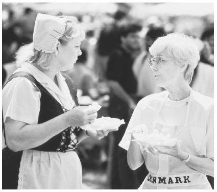 These Danish Americans are sampling the food at a 1995 ethnic festival.