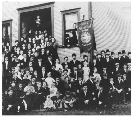 Finnish American proponents of socialism pose with their families outside their Glassport, Pennsylvania, meeting hall.
