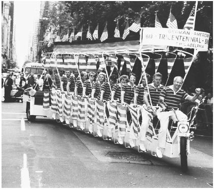 This German American Tricentennial Multicycle from Philadelphia, Pennsylvania, is traveling along Fifth Avenue in New York City during the 1988 Steuben Day Parade.