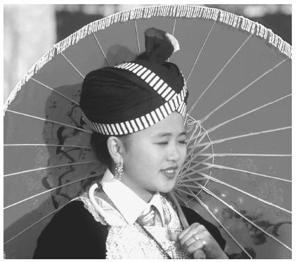 Hmong American Moua Vang is dressed up to celebrate at the New Years Festival in Fresno, California.
