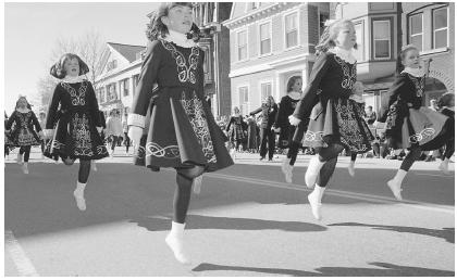 Irish step dancers prance along the parade route during a south Boston St. Patrick's Day Parade in 1997.