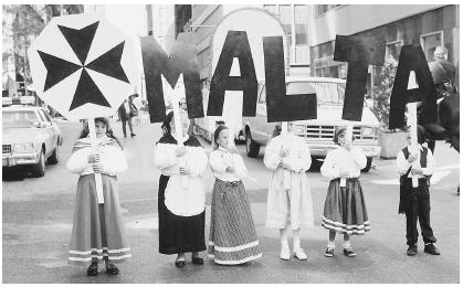 Maltese American children in traditional costume celebrate their homeland.