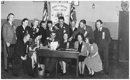 In this 1940 photograph, Norwegian Americans in New York City draw up a document to protest the German invasion of their homeland.