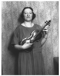 Romanian and Jewish American Regina Kohn was permitted to enter the United States because her violin playing so impressed immigration authorities at Ellis Island that they deemed her an artist. This photograph was taken on December 28, 1923.