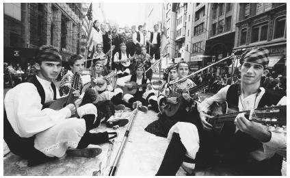 In this 1988 photograph, the Spanish Heritage Club of Queens, New York, joins the Aires de Aragon musical group for the United Hispanic American Parade in New York City.