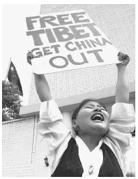 Tibetan American Tenzin Choezom demonstrates outside of the Chinese Consulate in Houstan for the fortieth anniversary of the Chinese occupation of Tibet, to protest human rights violations by the Chinese government and to demand freedom for Tibet.