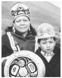 This photograph shows Tlingit Indians in traditional dress.