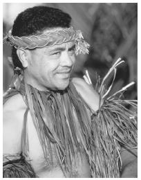 This Tongan American man is a primary participant in a luau.